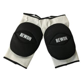 Rewon black and white knee pads offering advanced cushioning for boxing and fitness training.
